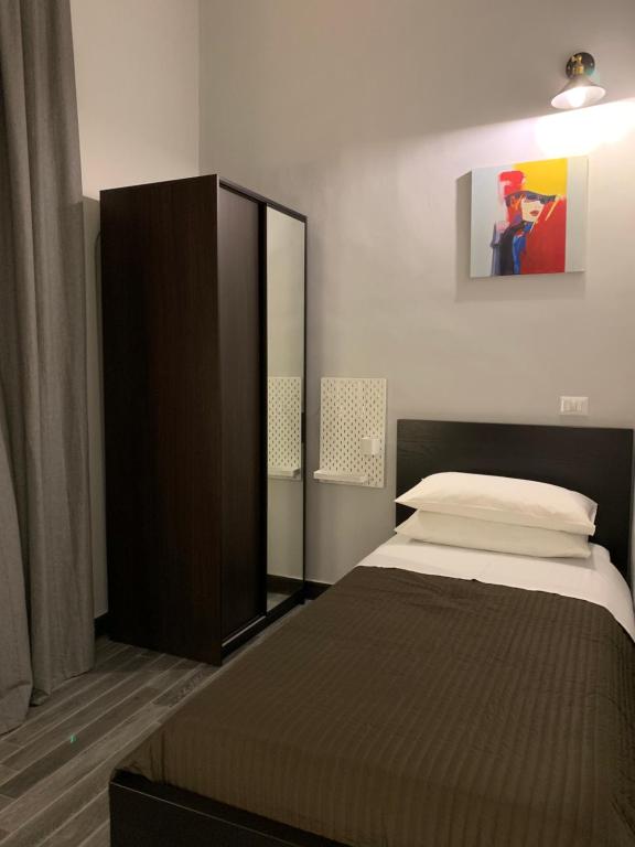 Postel nebo postele na pokoji v ubytování Caio Duilio B&B