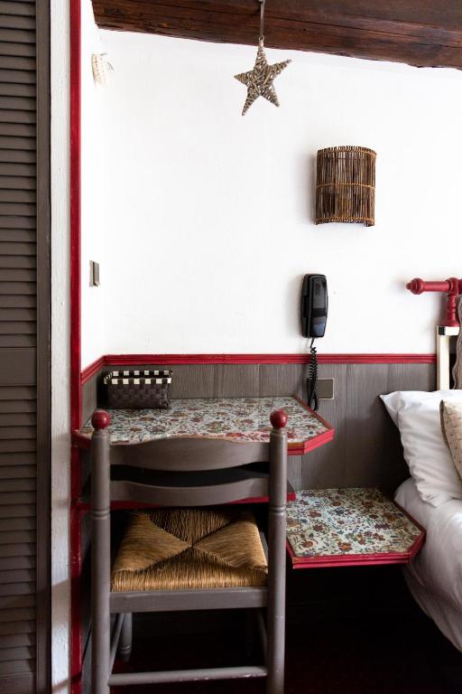 Postel nebo postele na pokoji v ubytování Hotel Mignon