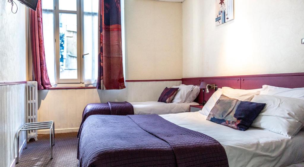Postel nebo postele na pokoji v ubytování Hotel Mignon