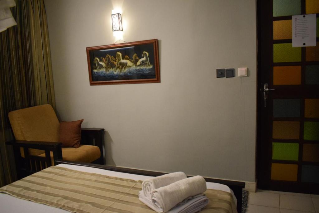 Postel nebo postele na pokoji v ubytování Grand Resort