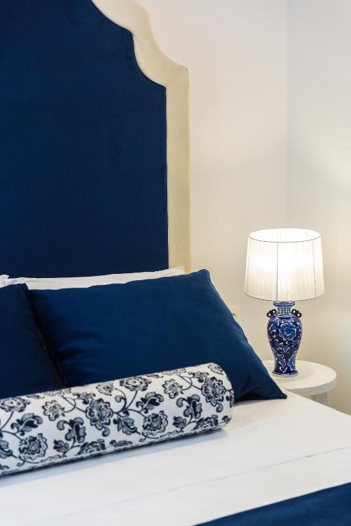 Łóżko lub łóżka w pokoju w obiekcie Georgioupolis Plaza Suites