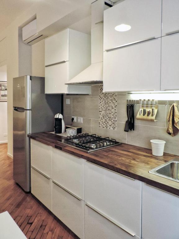 A kitchen or kitchenette at New Capolinea 5 - Apartment