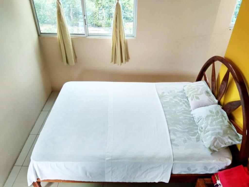 Postel nebo postele na pokoji v ubytování Hostal Alcazaba