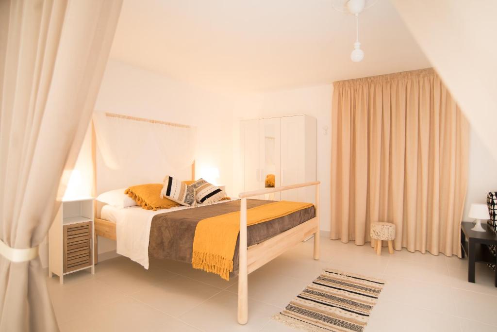 Кровать или кровати в номере Casa Napoletana - Dante
