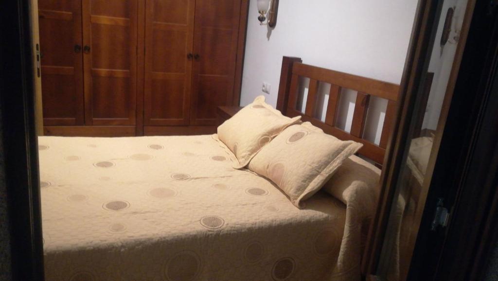A bed or beds in a room at Refugio La Covatilla I,II,III y IV