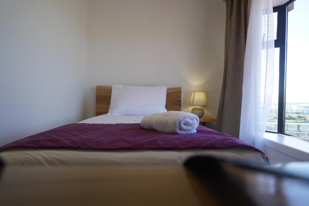 Postel nebo postele na pokoji v ubytování Hostal Doble E Patagonia