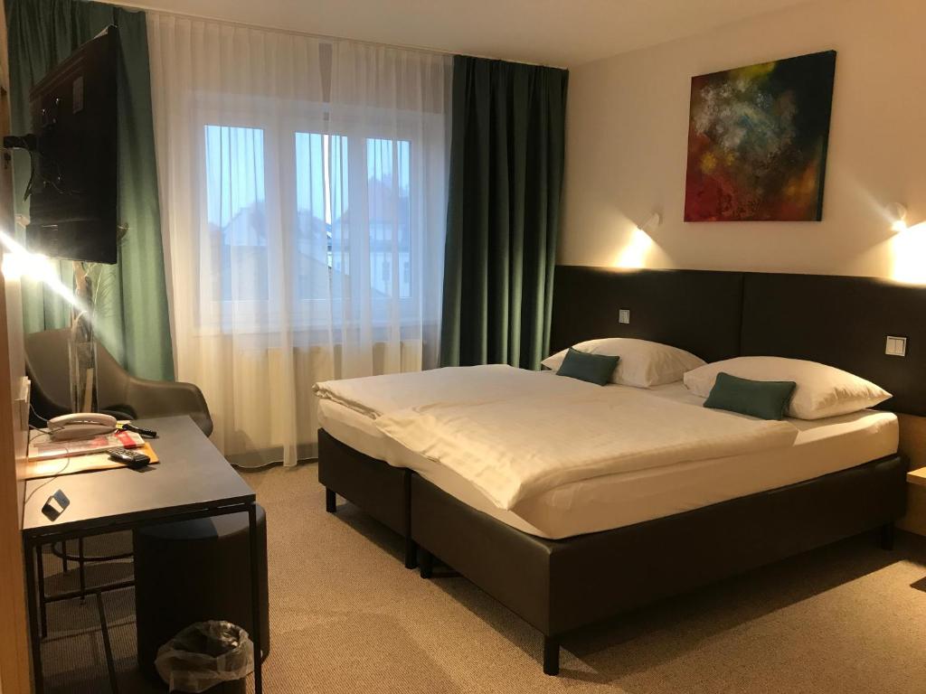 Posteľ alebo postele v izbe v ubytovaní Hotel-Gasthof Graf