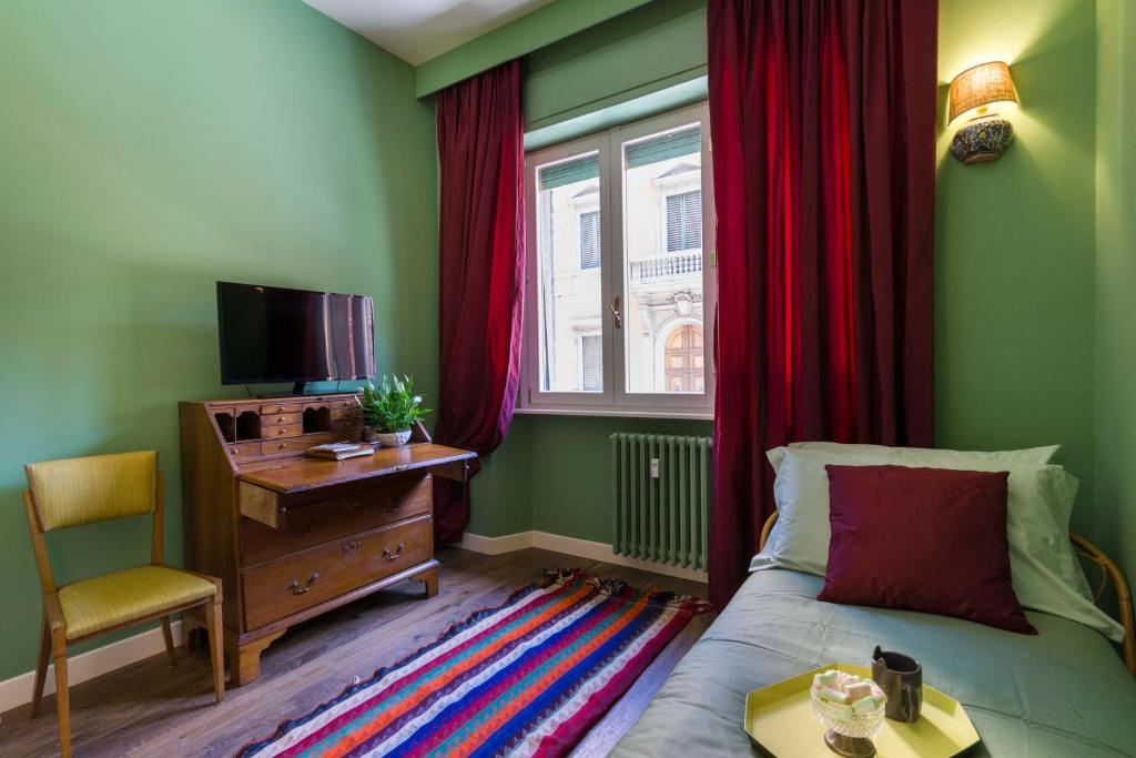 Televízia a/alebo spoločenská miestnosť v ubytovaní Frími Boutique Rooms b&b