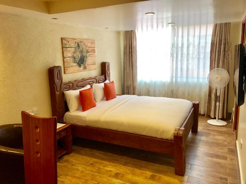 Postel nebo postele na pokoji v ubytování Progressive Park Hotel