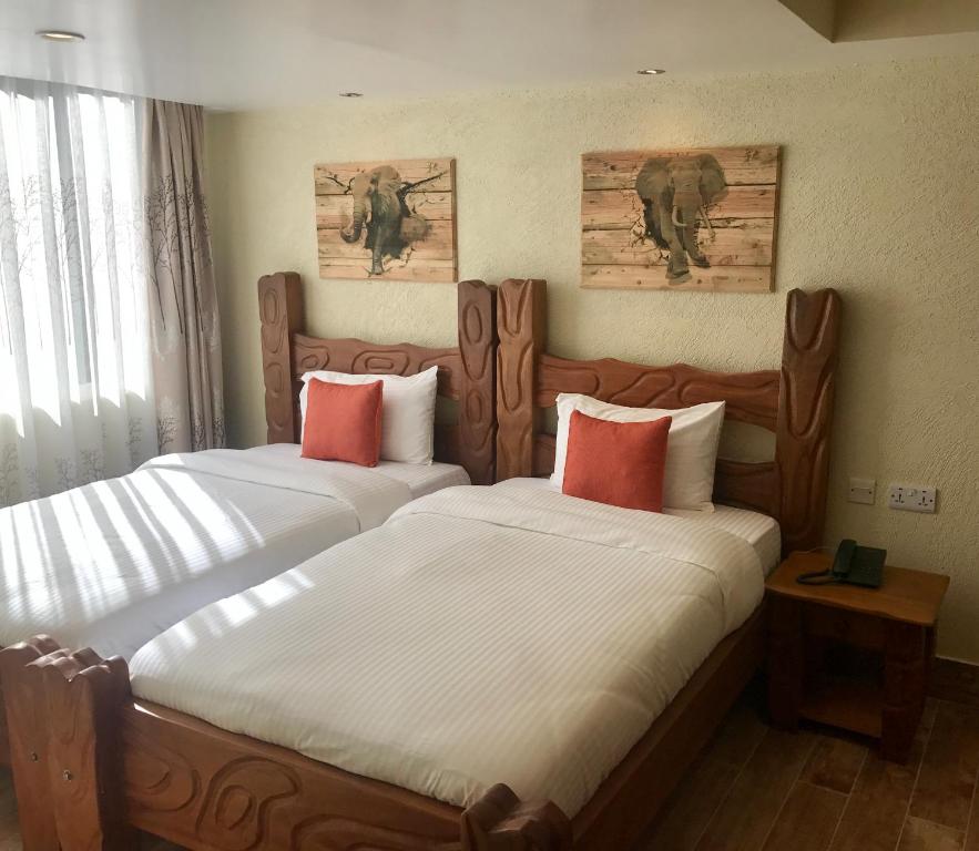 Postel nebo postele na pokoji v ubytování Progressive Park Hotel