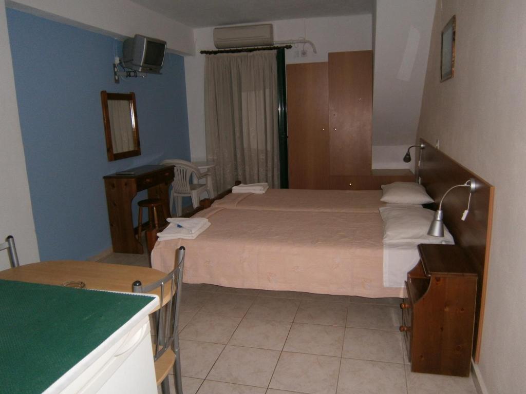 Postel nebo postele na pokoji v ubytování Petros Studios
