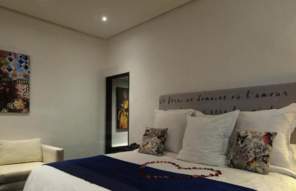 Postel nebo postele na pokoji v ubytování Le Sphinx Boutique Hôtel