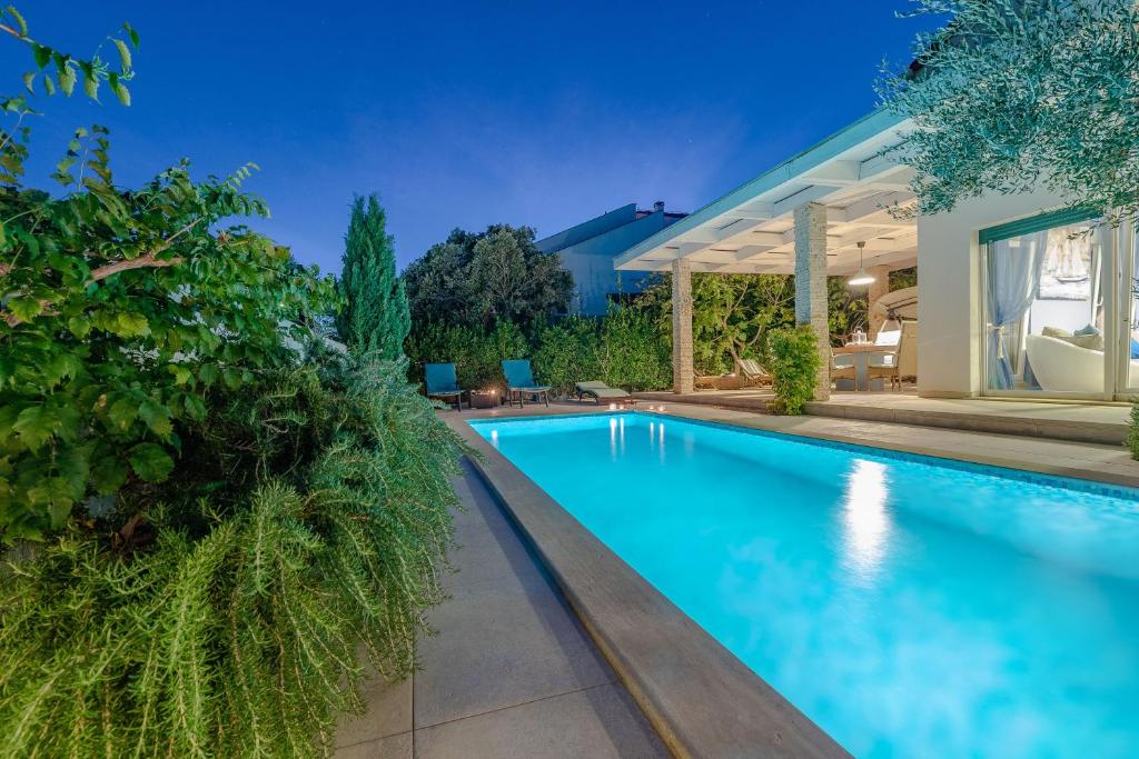an image of a swimming pool in a house at After All in Mandre
