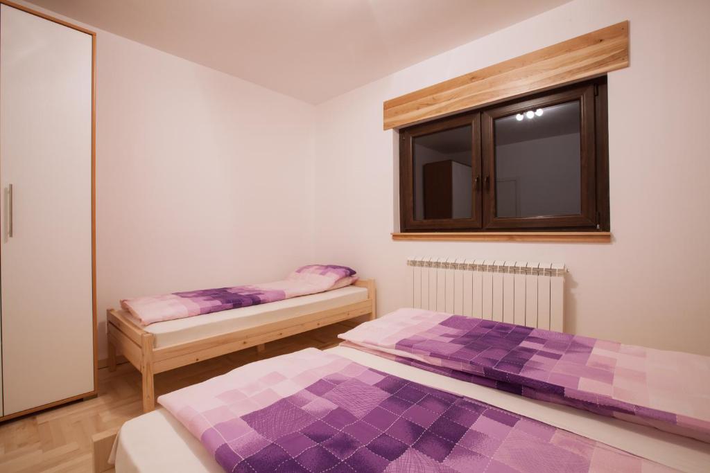 Postel nebo postele na pokoji v ubytování Vila Plamenac