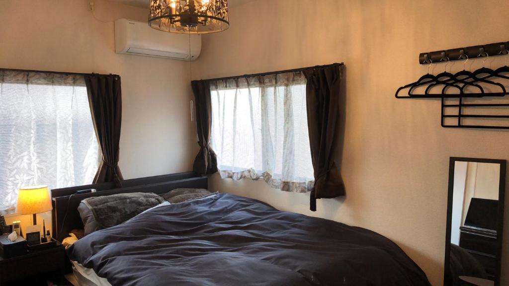 Postel nebo postele na pokoji v ubytování Guest House "Ro"kumano