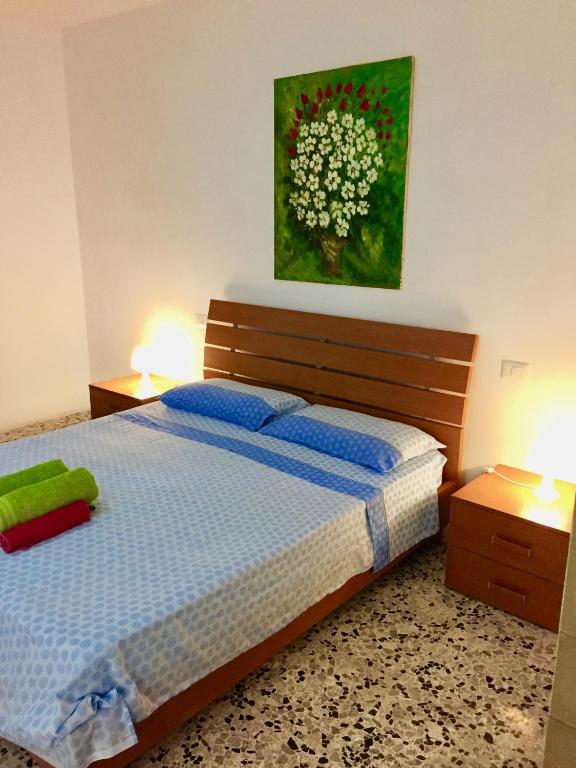 A bed or beds in a room at Salento Appartamenti