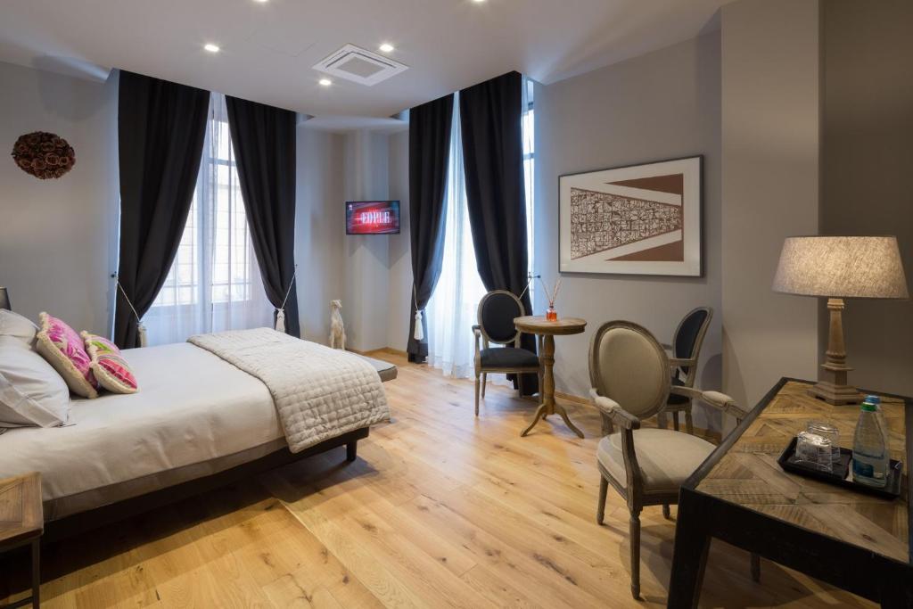 Ένα ή περισσότερα κρεβάτια σε δωμάτιο στο Il Duomo Luxury Suite
