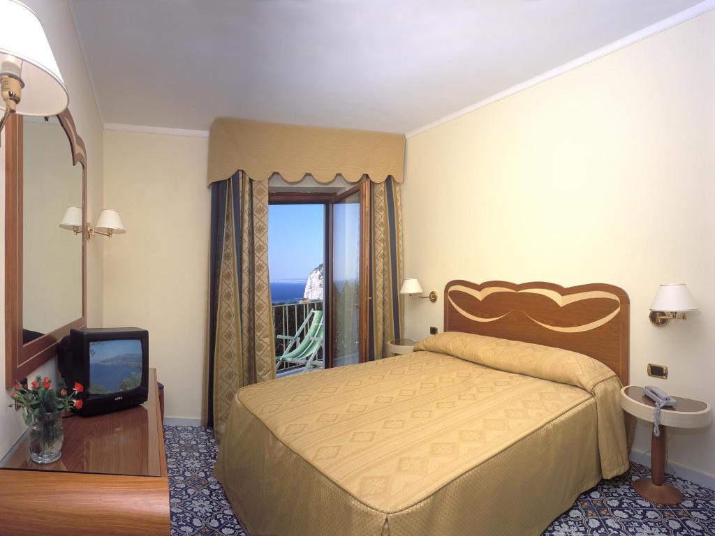 Postel nebo postele na pokoji v ubytování Hotel Albatros