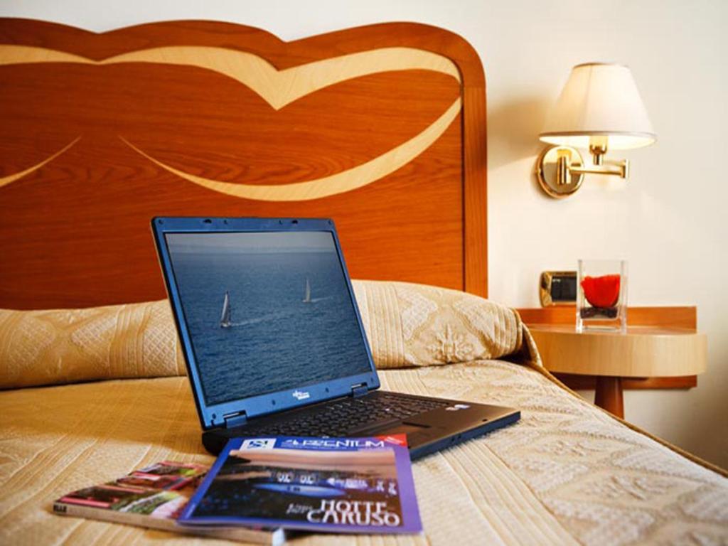 Postel nebo postele na pokoji v ubytování Hotel Albatros