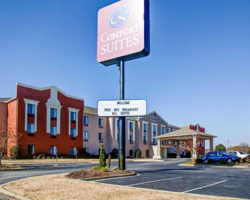 a sign in front of a building with a hospital at Comfort Suites Gadsden Attalla in Gadsden