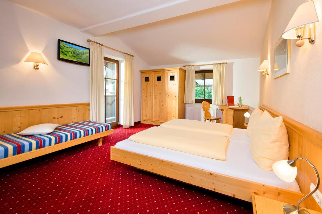 Postel nebo postele na pokoji v ubytování Hotel Reitlwirt