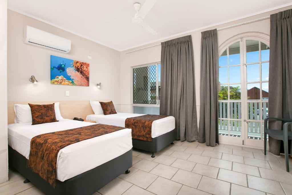 Postel nebo postele na pokoji v ubytování Comfort Inn Cairns City