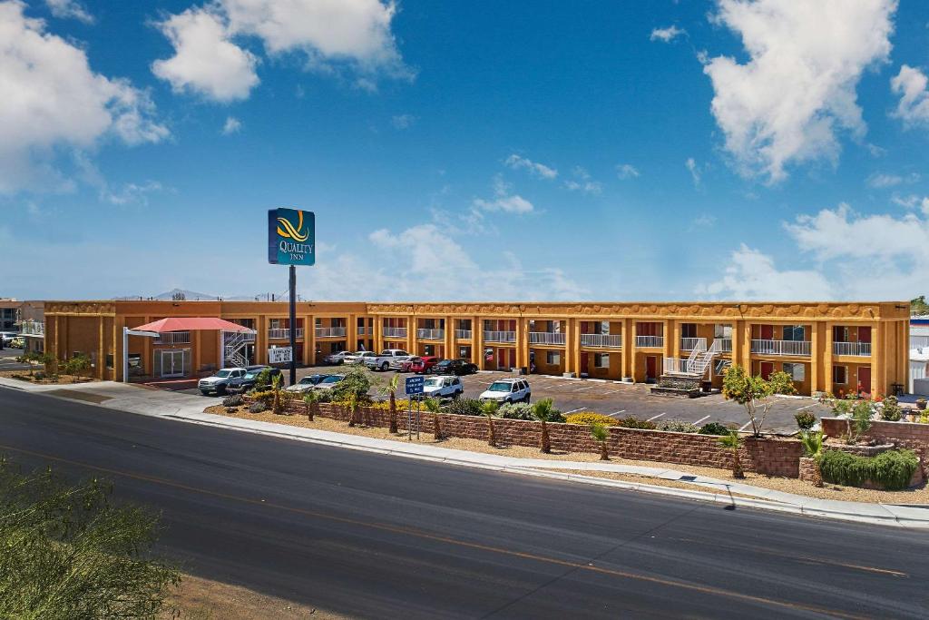 a large building with a parking lot in front of it at Quality Inn Parker in Parker