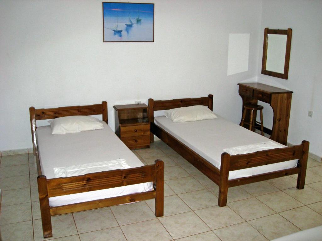 Postel nebo postele na pokoji v ubytování Petros Studios