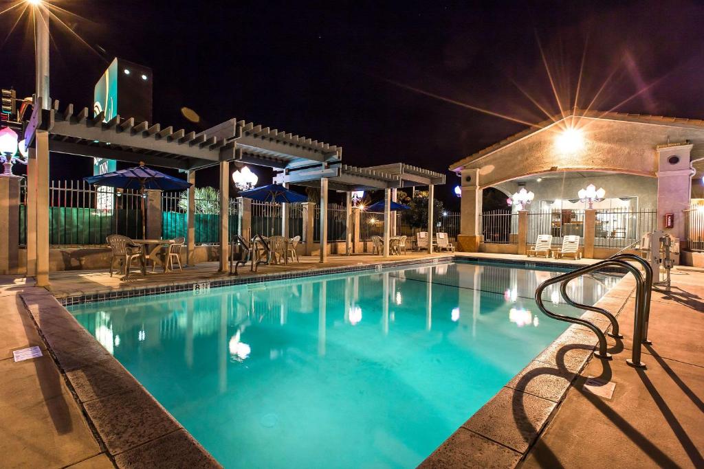 a pool at a hotel at night at Quality Inn Near China Lake Naval Station in Ridgecrest