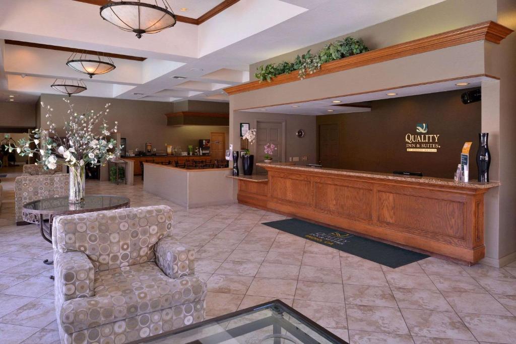 a lobby with a waiting area with a large screen at Quality Inn & Suites Indio I-10 in Indio