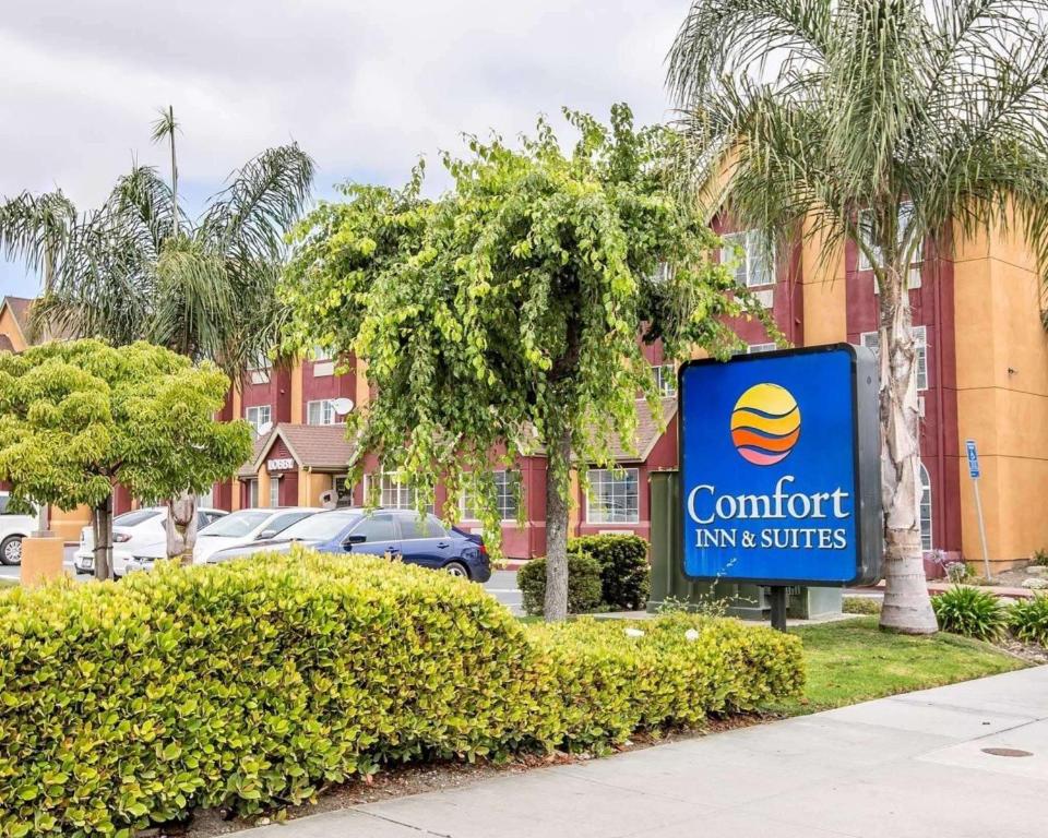 a sign for a comfort inn and suites at Comfort Inn & Suites Salinas in Salinas