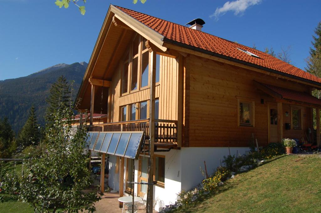 a house with a solar panel on the side of it at Ferienwohnung Haus Leonard in Ehrwald