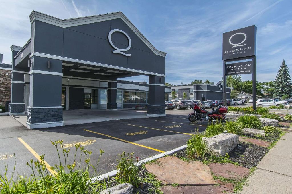 a store front with aundai dealership with a motorcycle parked in a parking lot at Quattro Hotel & Conf. Centre, Ascend Hotel Collection in Sault Ste. Marie