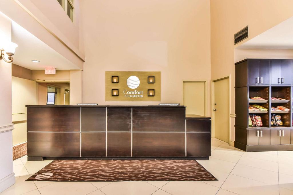 a lobby at a hospital with a reception counter at Comfort Inn & Suites Ambassador Bridge in Windsor