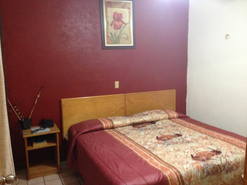 Postel nebo postele na pokoji v ubytování Hotel Primavera