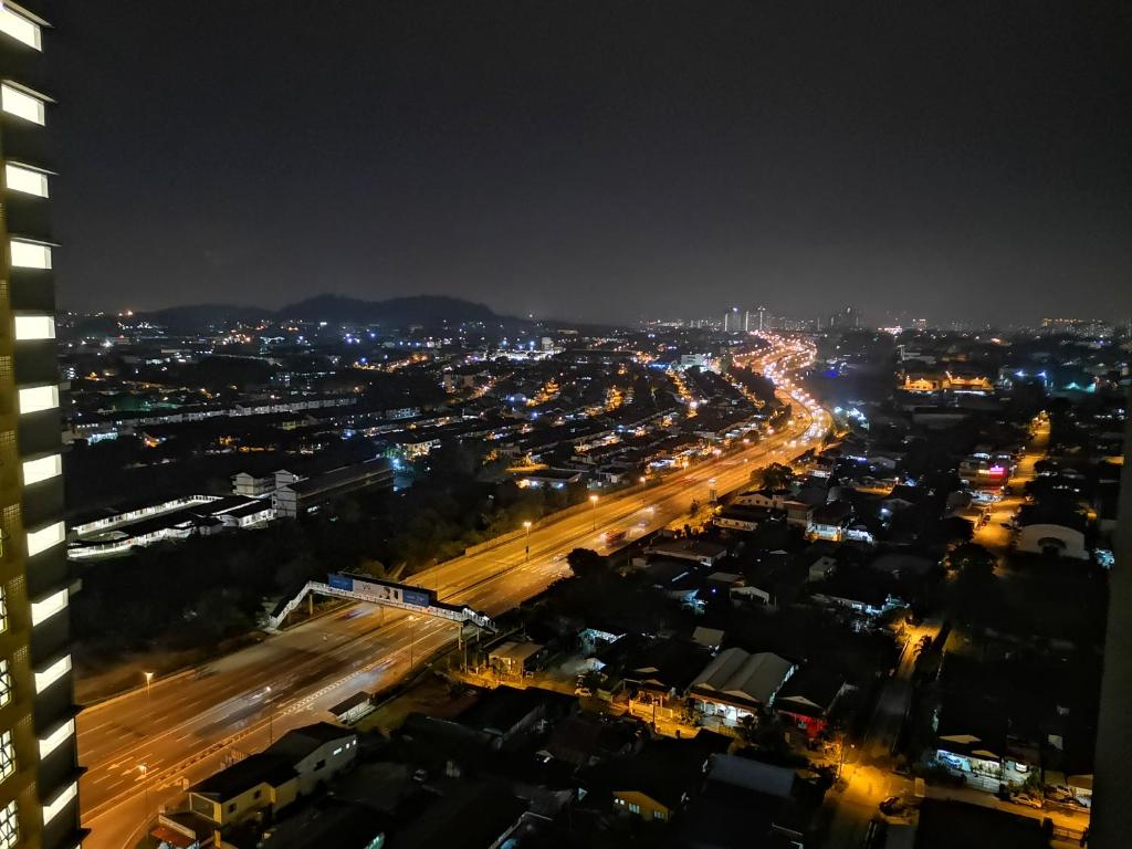 a city lit up at night with traffic at Sweet Home Silk Sky Residence Balakong Seri Kembangan in Seri Kembangan