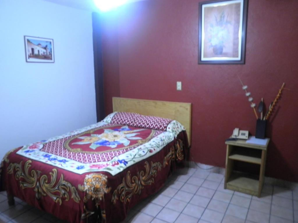 Postel nebo postele na pokoji v ubytování Hotel Primavera