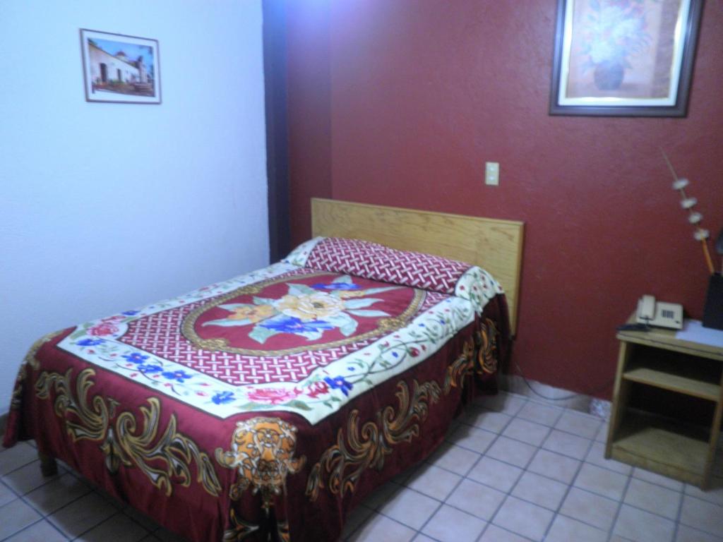 Postel nebo postele na pokoji v ubytování Hotel Primavera