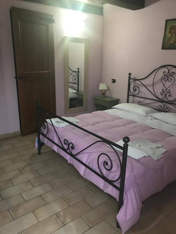 Łóżko lub łóżka w pokoju w obiekcie Agriturismo Ca'Verdeselle