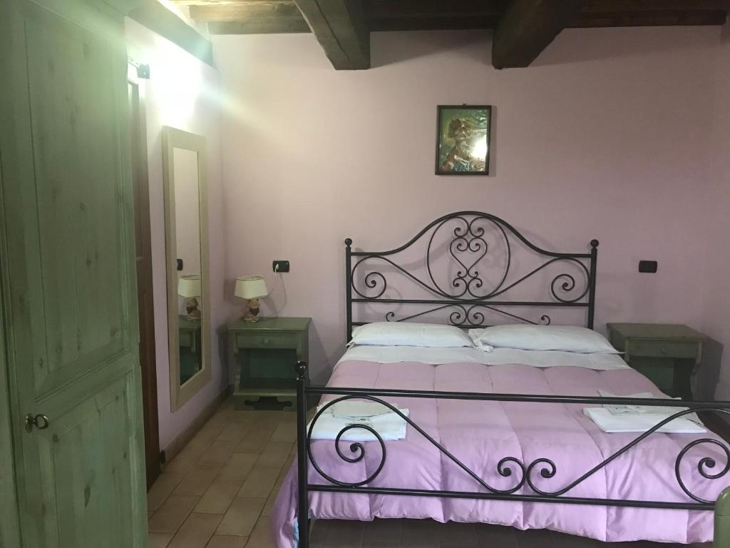 Łóżko lub łóżka w pokoju w obiekcie Agriturismo Ca'Verdeselle