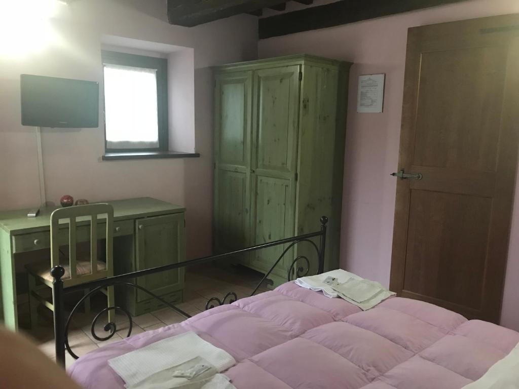 Łóżko lub łóżka w pokoju w obiekcie Agriturismo Ca'Verdeselle
