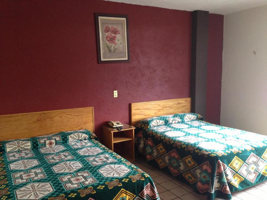 Postel nebo postele na pokoji v ubytování Hotel Primavera
