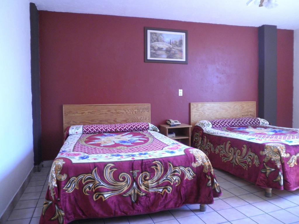 Postel nebo postele na pokoji v ubytování Hotel Primavera