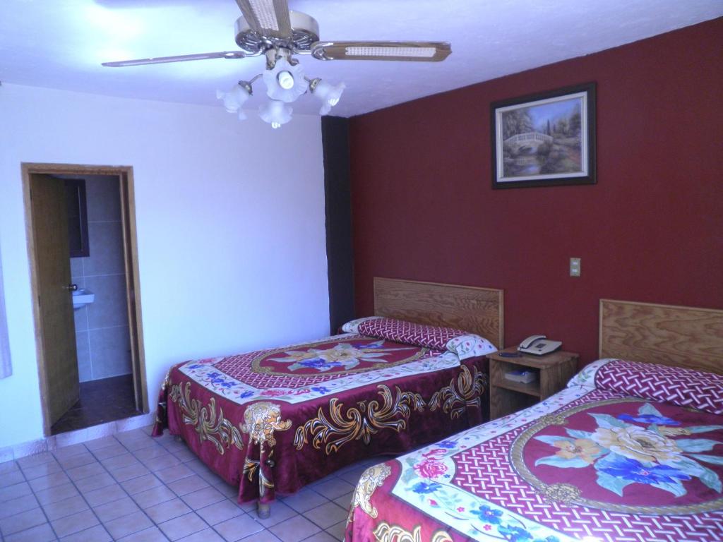 Postel nebo postele na pokoji v ubytování Hotel Primavera