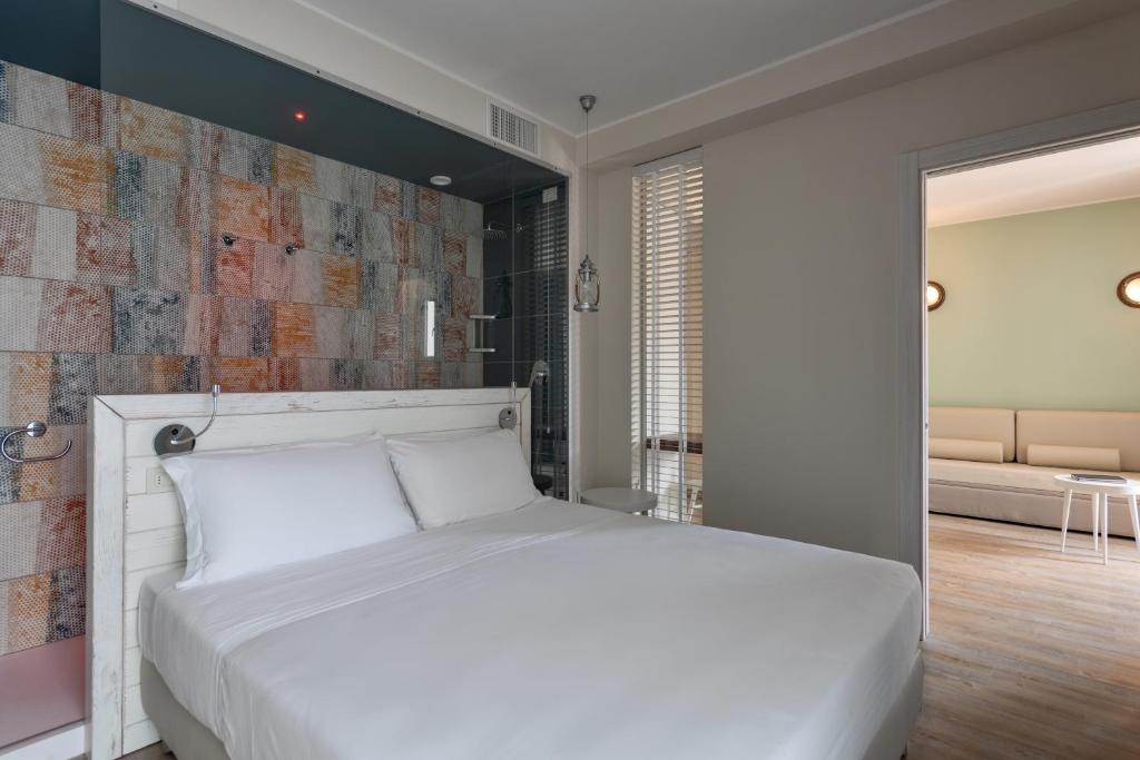 Postel nebo postele na pokoji v ubytování Hotel San Michele