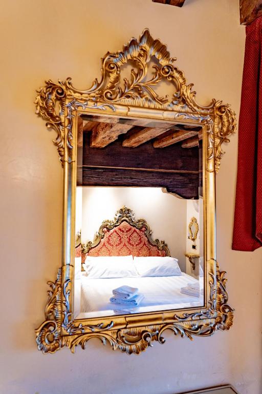 Postel nebo postele na pokoji v ubytování Hotel Vecellio Venice on the Lagoon