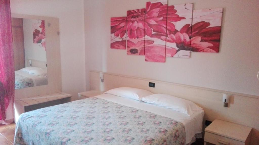 Postel nebo postele na pokoji v ubytování Albergo Neni