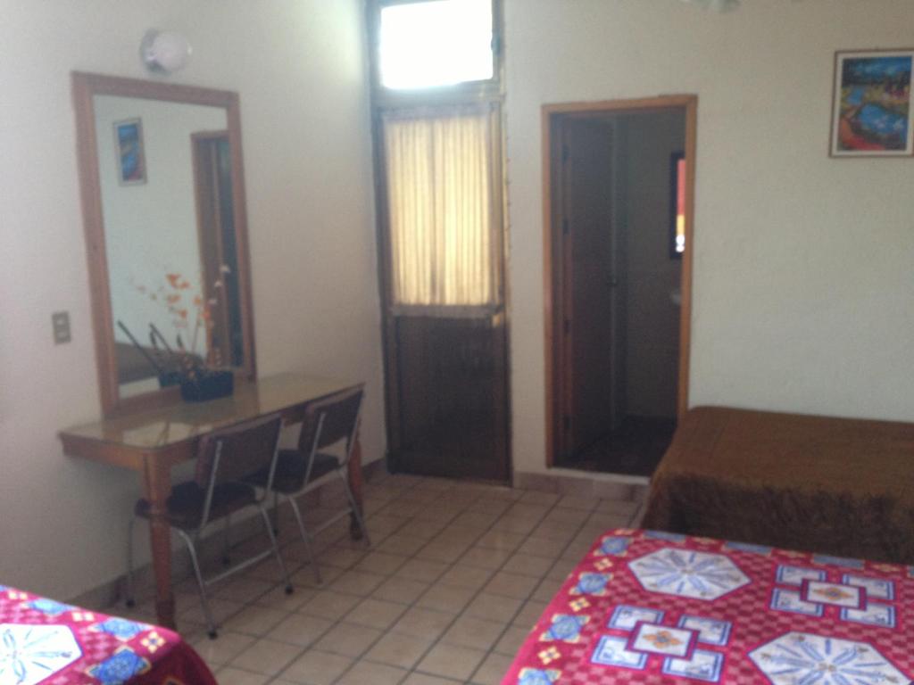 Postel nebo postele na pokoji v ubytování Hotel Primavera