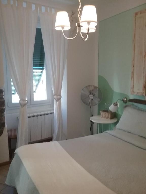 Кровать или кровати в номере La Gioia