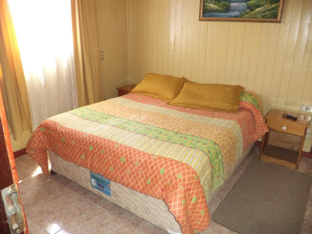 Postel nebo postele na pokoji v ubytování Hostal Emalafquen